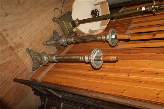 A pair of decorative brass altar sticks, 41in.